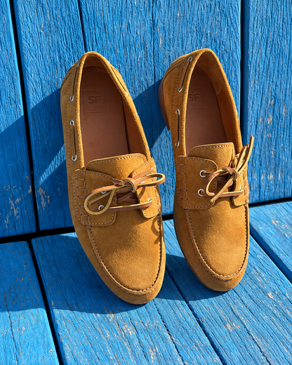 Riva Dijon suede shoes on a blue wooden bench