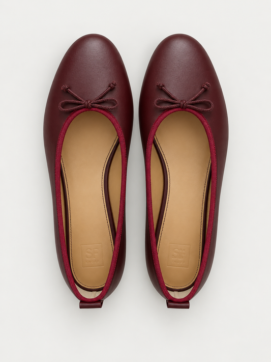 Lido Burgundy ballet flats by SF Shoes on a neutral background.